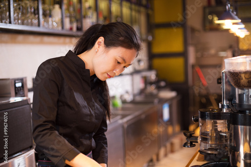 waitress serving in modern cafe