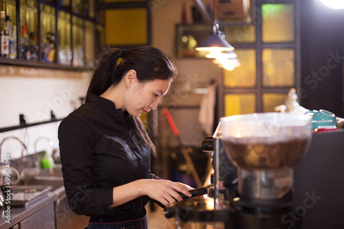 waitress serving in modern cafe