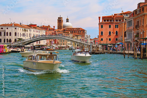 Venice. Boats in Grand Canal near the Ponte degli Scalzi photo