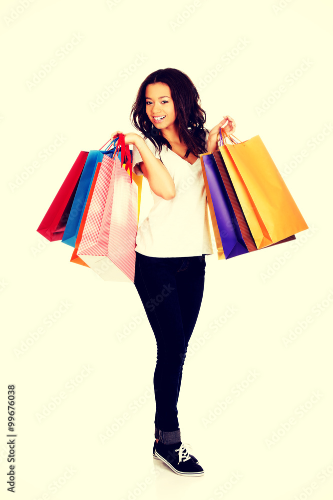 Happy smiling woman with shopping bags.