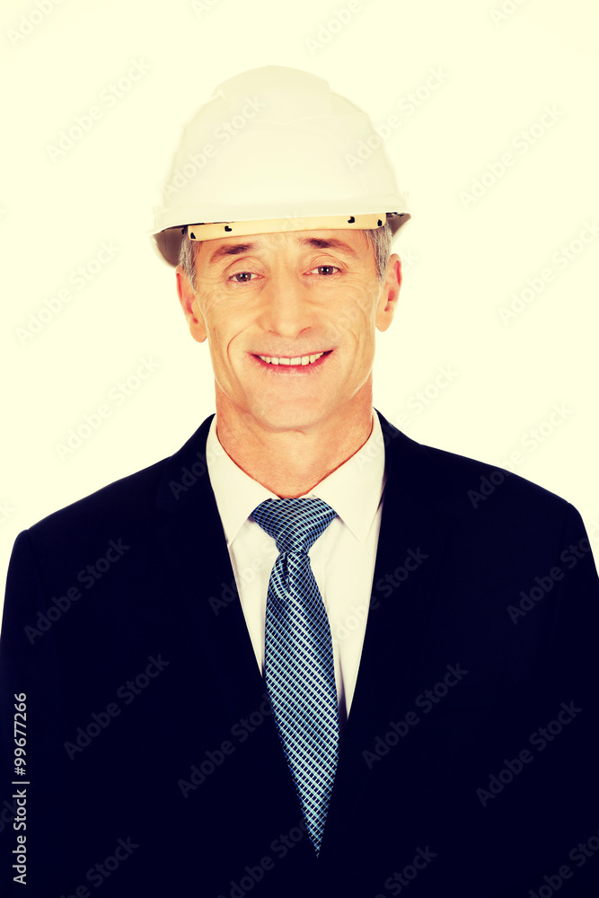 Smiling businessman with hard hat Smiling businessman with hard hat