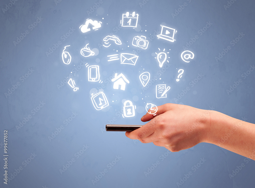 Hand holding tablet phone with drawn icons Hand holding tablet phone with drawn icons