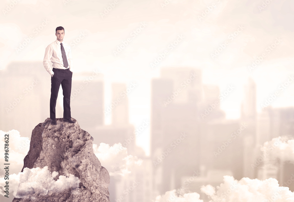 Confident businessman on dangerous cliff Confident businessman on dangerous cliff
