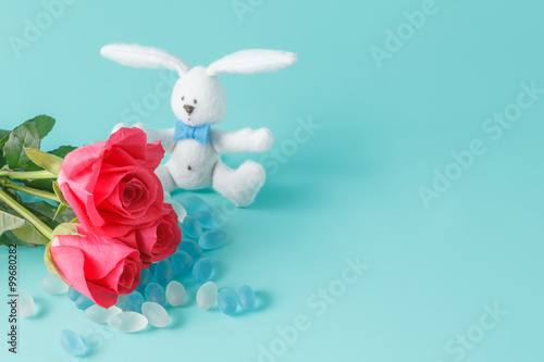 Bunny toys with rose flower © Andrey Cherkasov