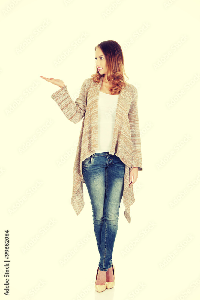Beautiful woman showing empty hand. Beautiful woman showing empty hand.
