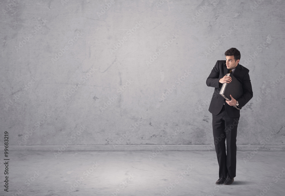 Young businessman standing confused