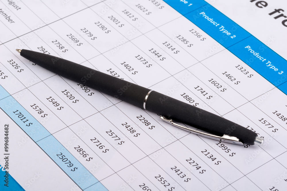 The black handle lays on financial statement The black handle lays on financial statement