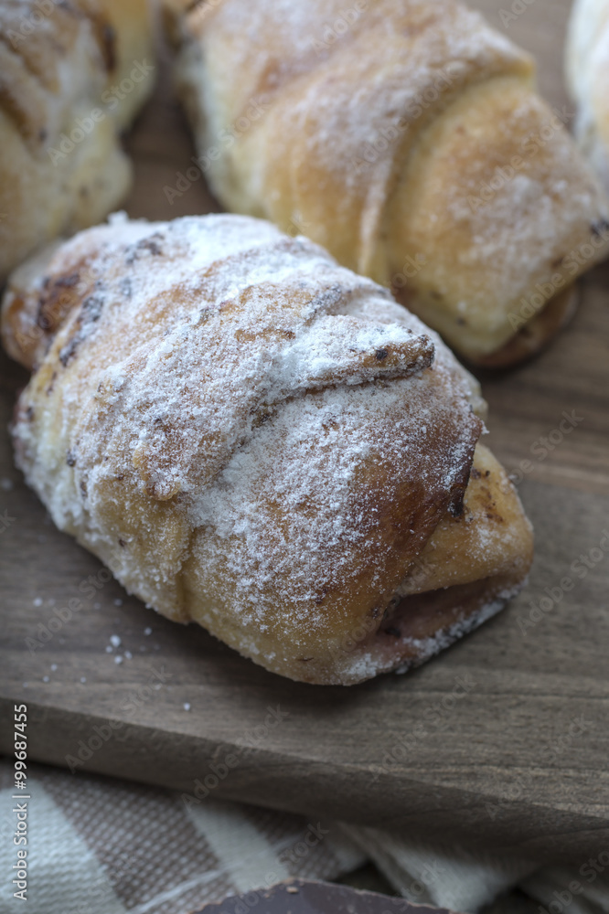 Baked croissants stuffed with jam Baked croissants stuffed with jam