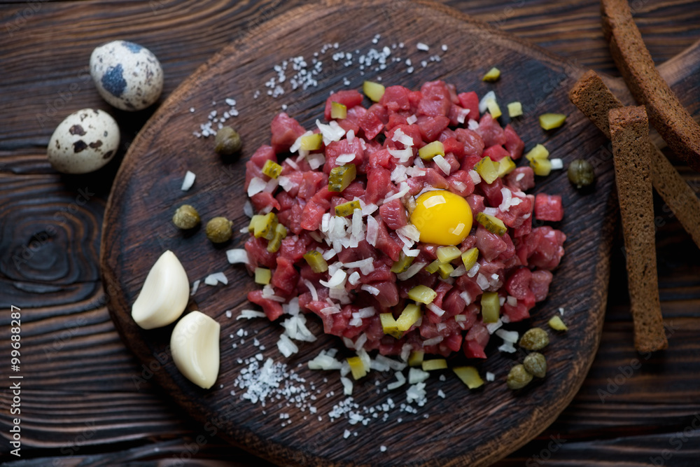 Close-up of beef steak tartare, studio shot, high angle view Close-up of beef steak tartare, studio shot, high angle view