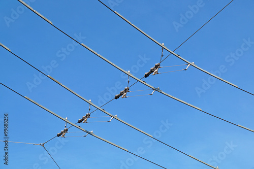 tram wires with blue sky background © steuccio79