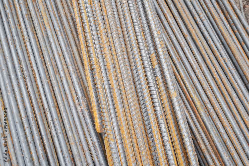 Stack of rusty round steel bar - iron metal rail lines material Stack of rusty round steel bar - iron metal rail lines material