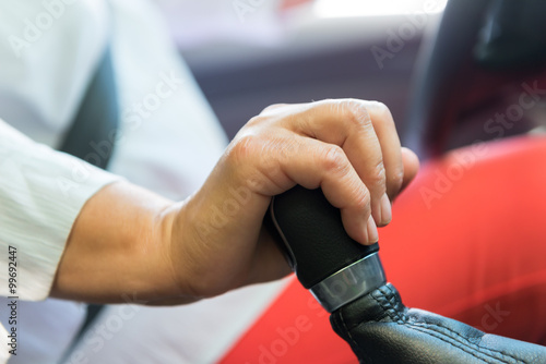 female hand close up on a shift knob