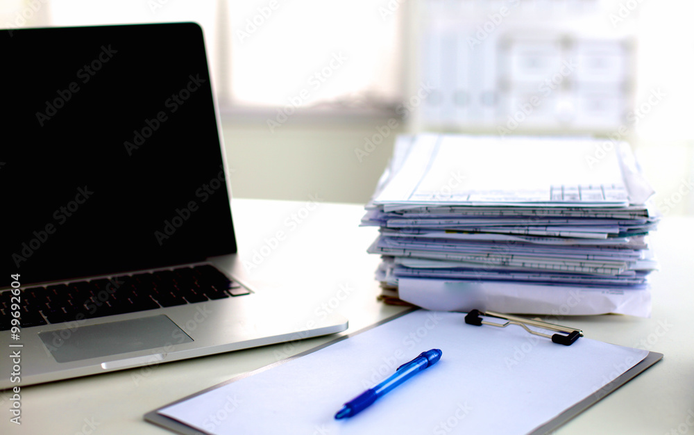 office desk a stack of computer paper reports work forms office desk a stack of computer paper reports work forms
