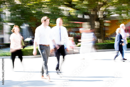 LONDON UK - SEPTEMBER 10, 2015: City of London lunch time. Lots of office people walking on the street. People blur