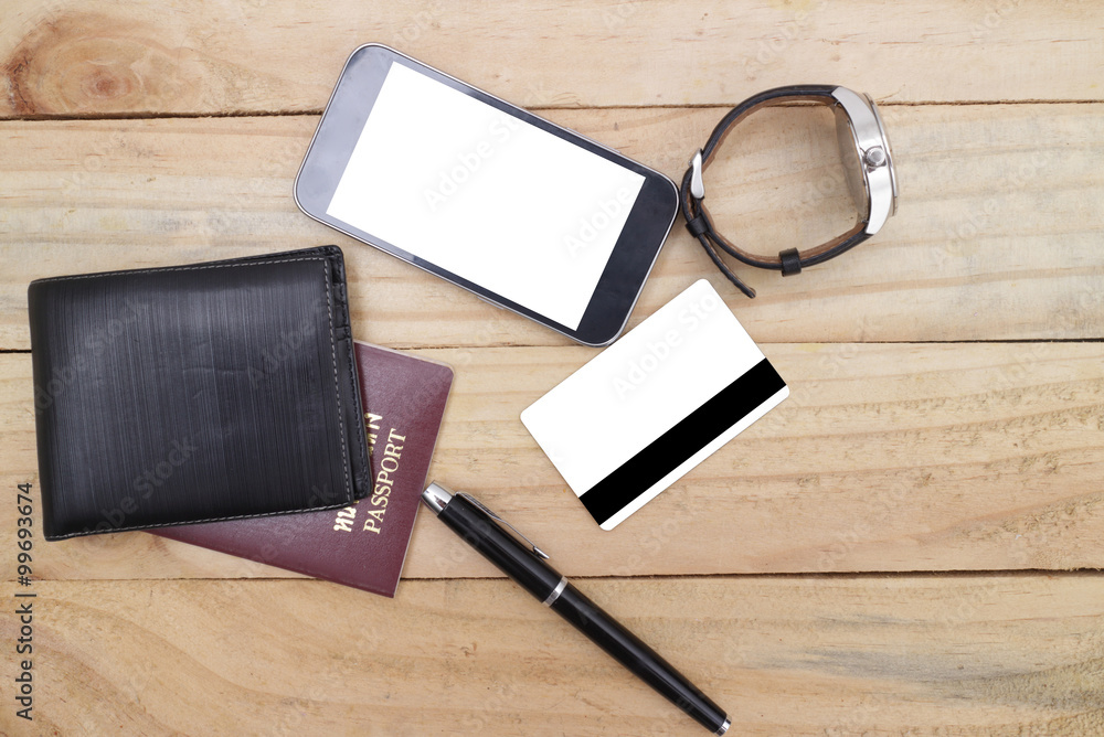 Travel arrangement of wallet with credit card , passports, compass on wood table background. Travel concept. Travel arrangement of wallet with credit card , passports, compass on wood table background. Travel concept.