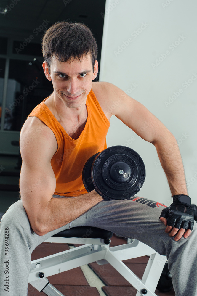 Man makes exercises for biceps Man makes exercises for biceps