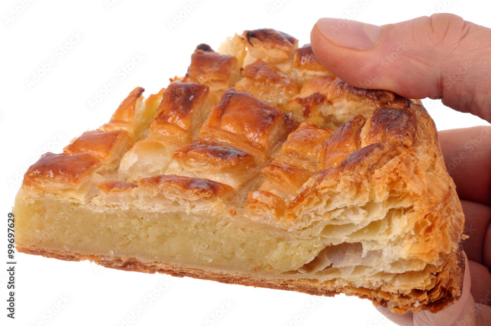 Part de galette des rois en main Part de galette des rois en main