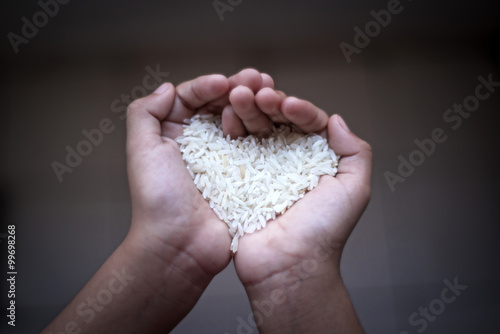 Hands holding rice.selective focus and shallow depth of field.