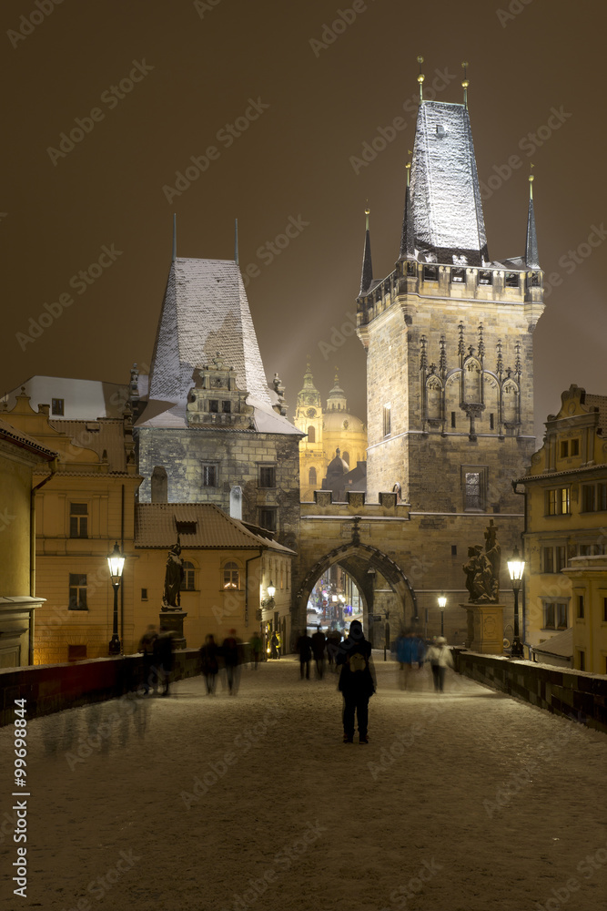Obraz premium Night romantic snowy Prague Lesser Town from Charles Bridge, Czech republic