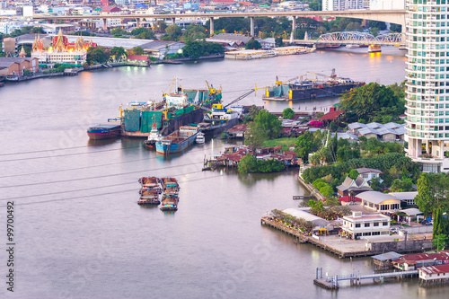 Aerial view of tugboat shipping barges, Bangkok city at Chao Pha photo