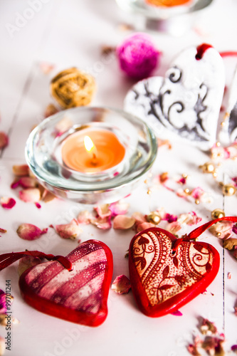 Holidays, a gift and a heart on a wooden background / valentine's day background