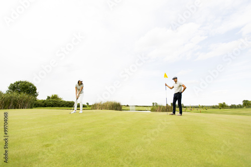 Young couple at golf court