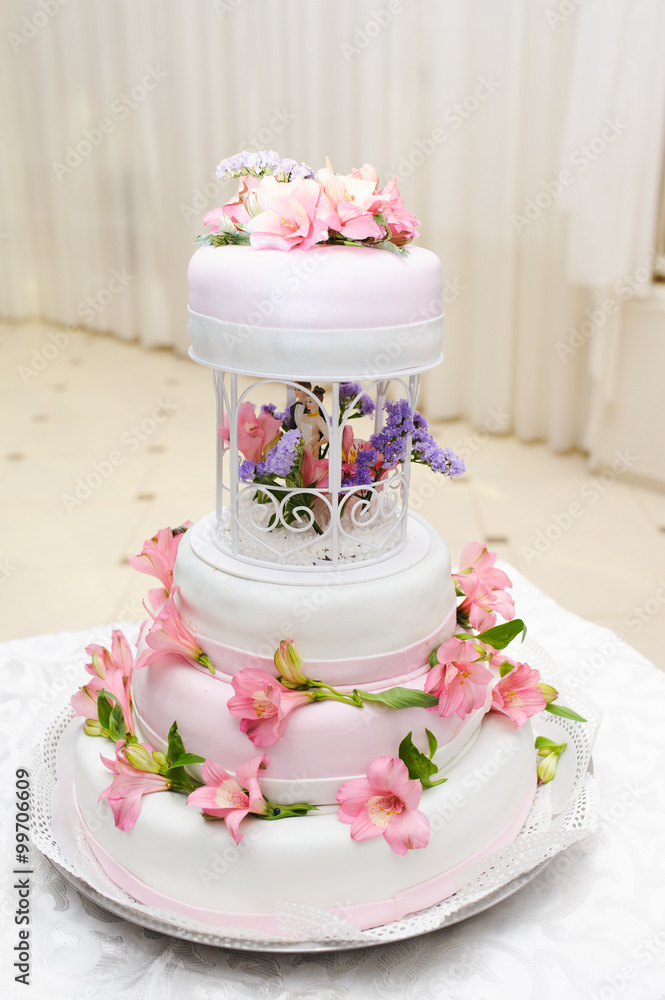 Wedding Cake decorated with pink lily flowers Wedding Cake decorated with pink lily flowers