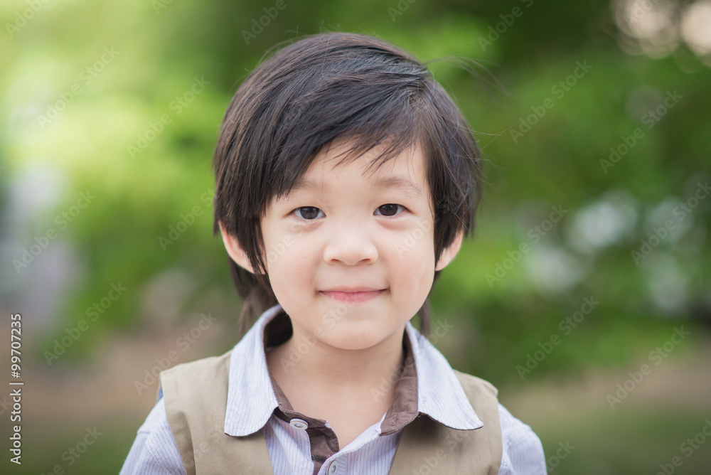 asian boy smiling and looking at camera portrait asian boy smiling and looking at camera portrait