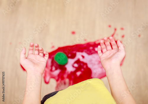child dropped a jar of jam on the floor. shattered into pieces jar of jam on the floor, top view