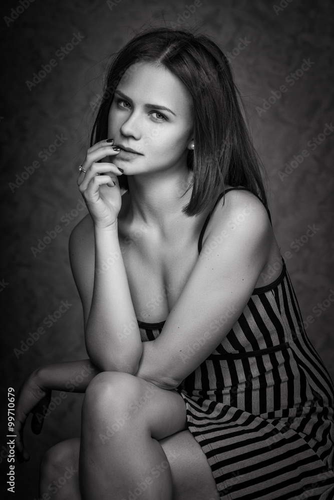 Portrait of wonderful young woman with long hair looking at camera, smiling Portrait of wonderful young woman with long hair looking at camera, smiling