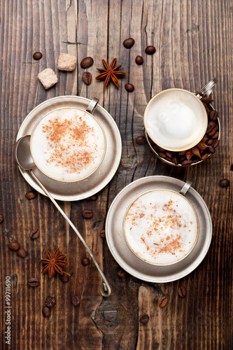 Coffee cappuccino cup on wooden background. Top view