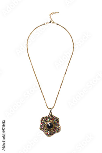gold pendant with a black gems on a white background
