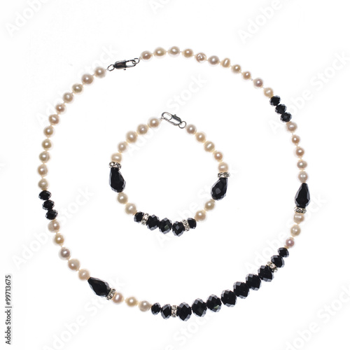 set of bracelet and beads on white background