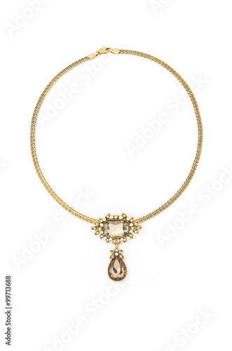 gold necklace with stone a white background