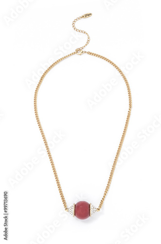 gold pendant with bead on a white background