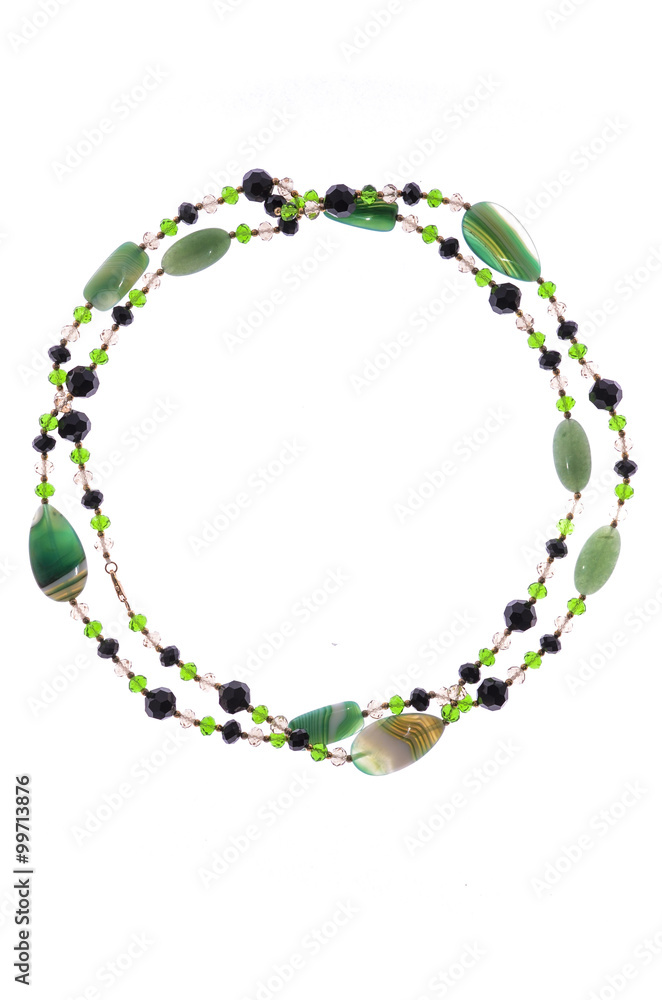 Green necklace with beads on a white background Green necklace with beads on a white background