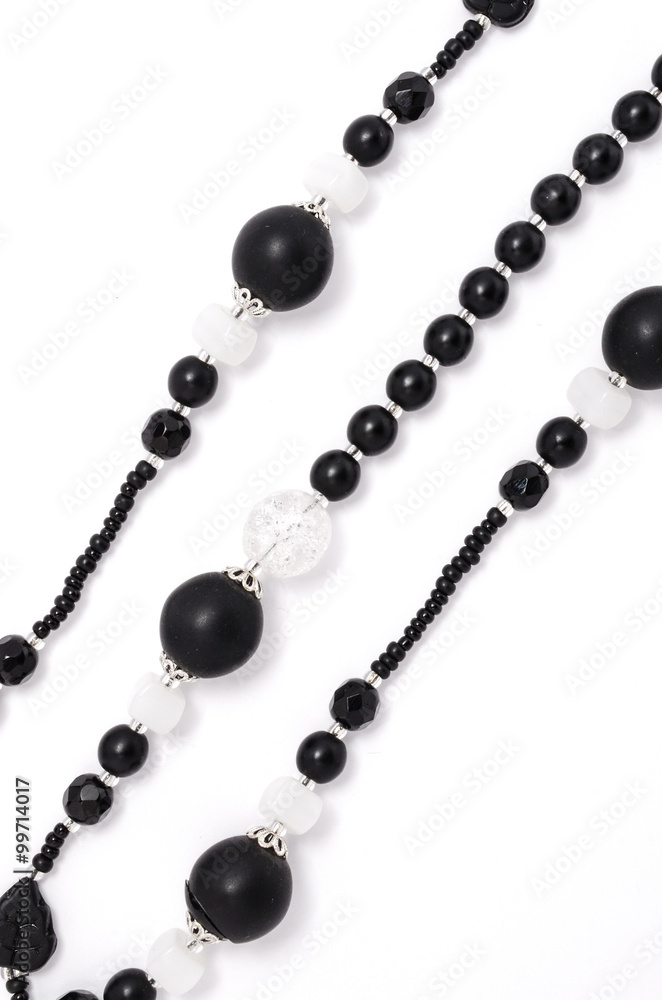 black and white beads closeup on a white background black and white beads closeup on a white background