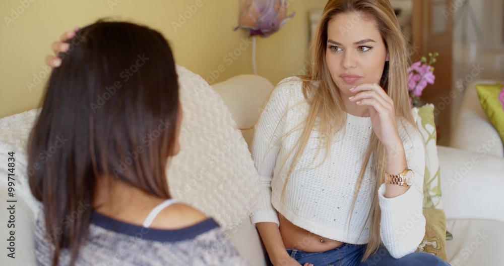 Two young woman in a serious discussion Two young woman in a serious discussion