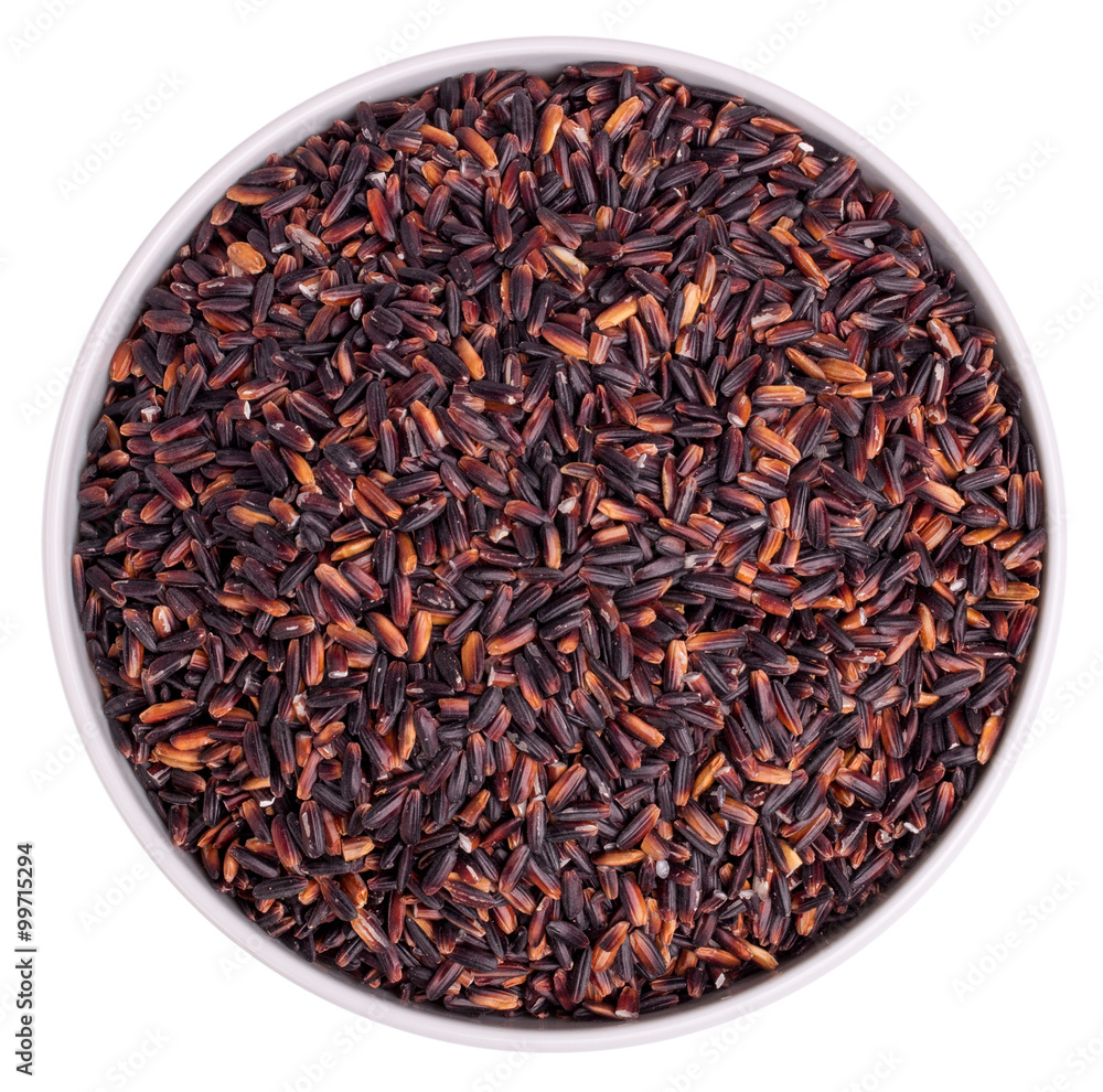 Top view black rice in a glass bowl on a white background Top view black rice in a glass bowl on a white background