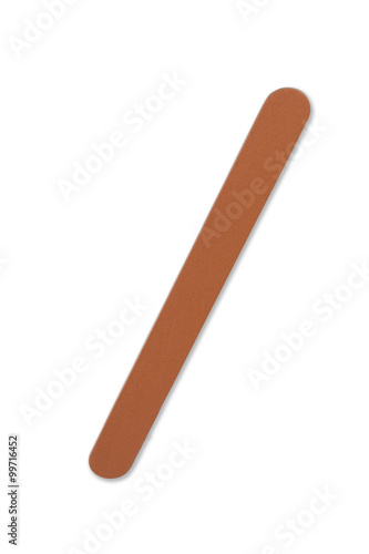 one orange nail file on a white background