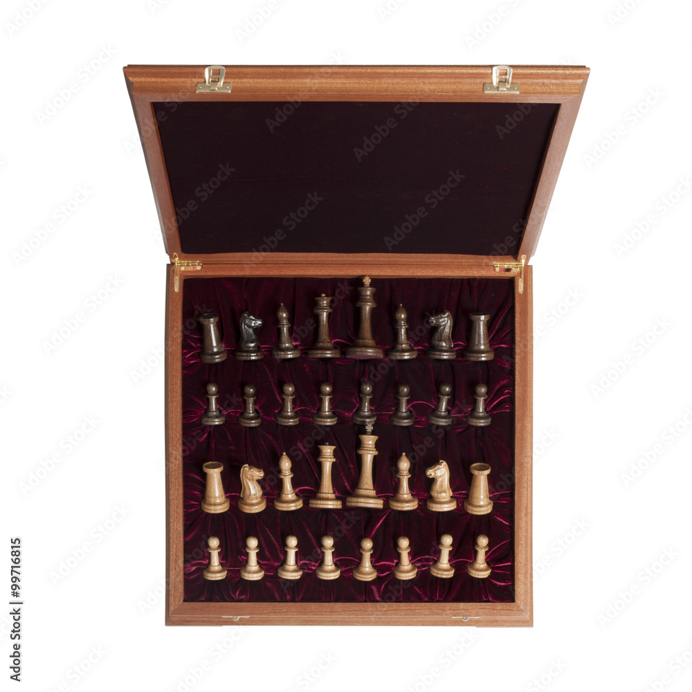 chess pieces in a beautiful box on a white background chess pieces in a beautiful box on a white background