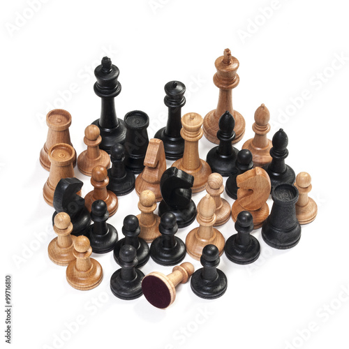 wooden chessmen on a white background © vitaly tiagunov