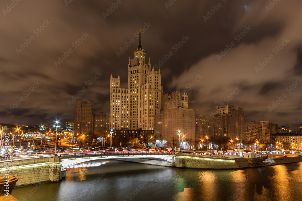 High-rise building on Kotelnicheskaya embankment and Traffic Trails at night. Moscow, Russia.