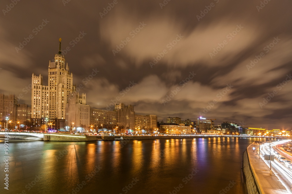 High-rise building on Kotelnicheskaya embankment in Moscow at night.