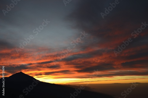 sunset and storm clouds in teide volcano