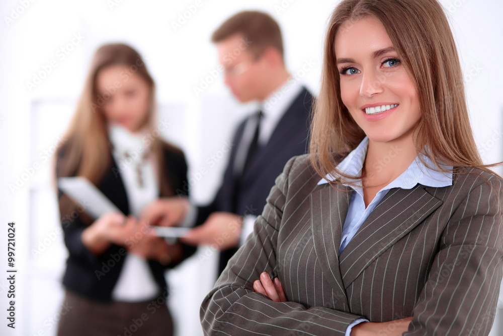 Face of beautiful cheerful smiling business woman on the background of business people Successful business concept Face of beautiful cheerful smiling business woman on the background of business people Successful business concept
