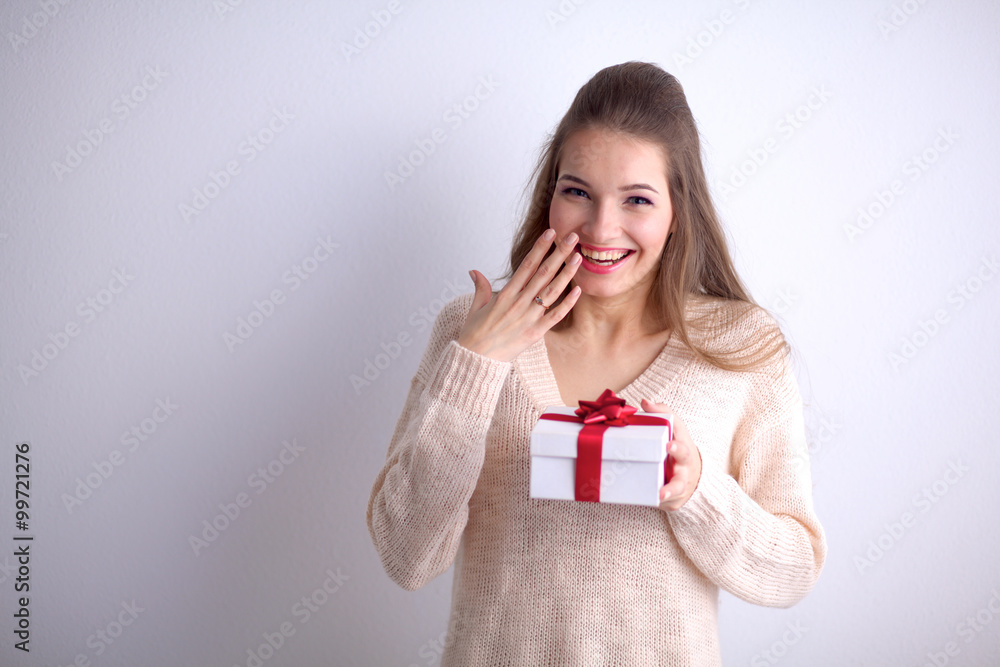 Young woman happy smile hold gift box in hands Young woman happy smile hold gift box in hands