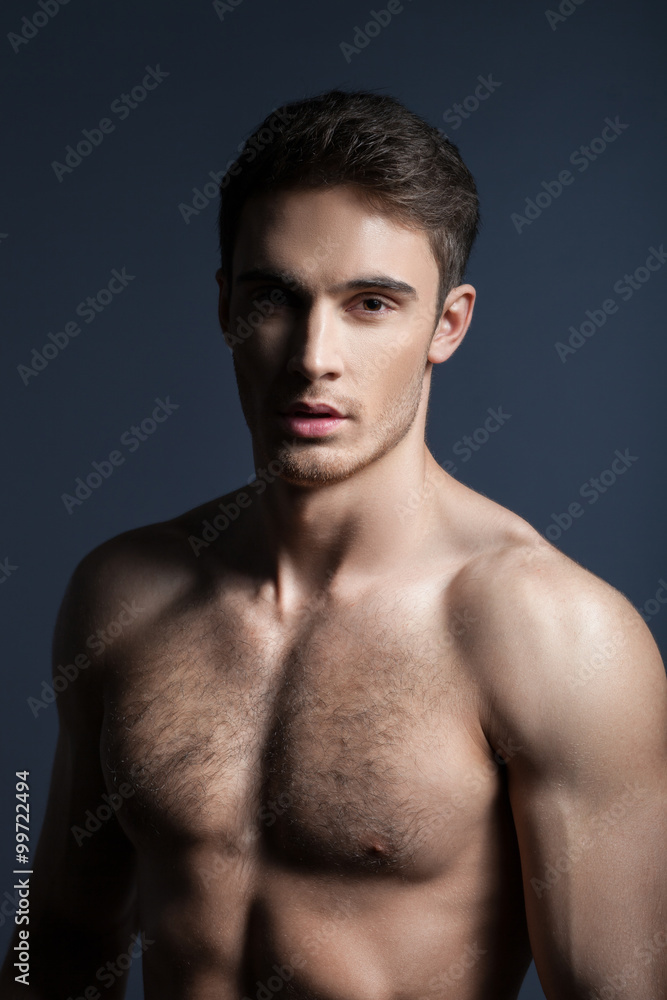 Handsome young guy is expressing his sexuality