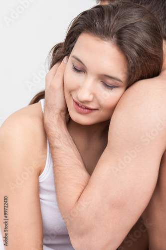 Attractive young man and woman resting at home
