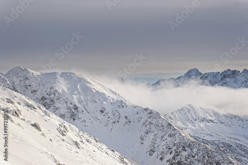 Clouds atop of Kasprowy Wierch of Zakopane in Tatras in winter